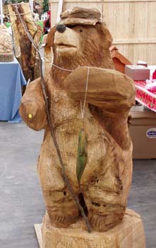 Fishing Bear dressed in bibs and fishing hat with fishing pole