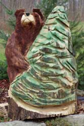 Bear holding a Christmas Tree